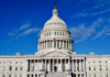US Capitol Building against blue sky.