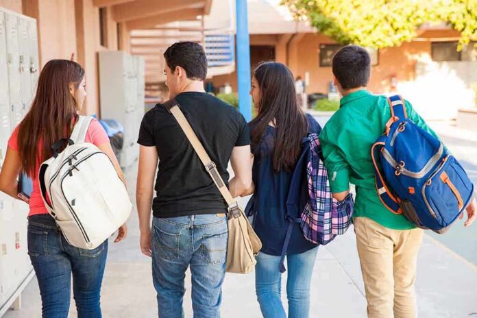 Group of students walking together in a school corridor