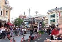 Crowd gathered at a Disney theme park for a Pirates of the Caribbean event
