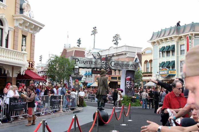 Crowd gathered at a Disney theme park for a Pirates of the Caribbean event