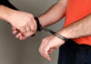 Person handcuffing another persons wrists