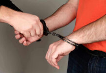 Person handcuffing another persons wrists