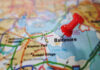 Red pushpin marking Baltimore on a map.
