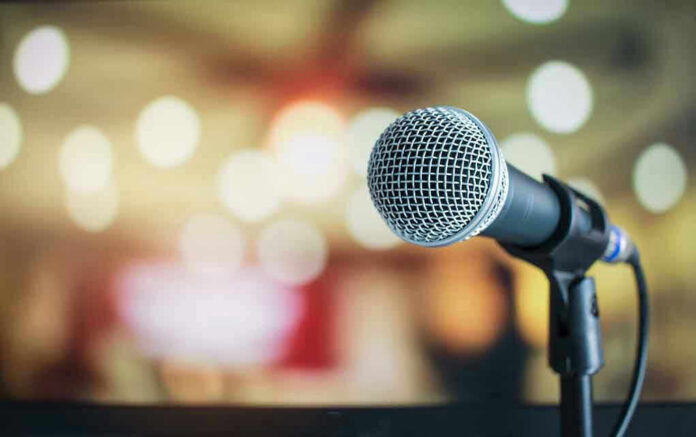 Microphone with blurred lights in the background.