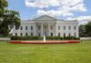 The White House with a fountain and flower beds in front