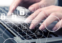 Hands typing with cybersecurity icons overlay.