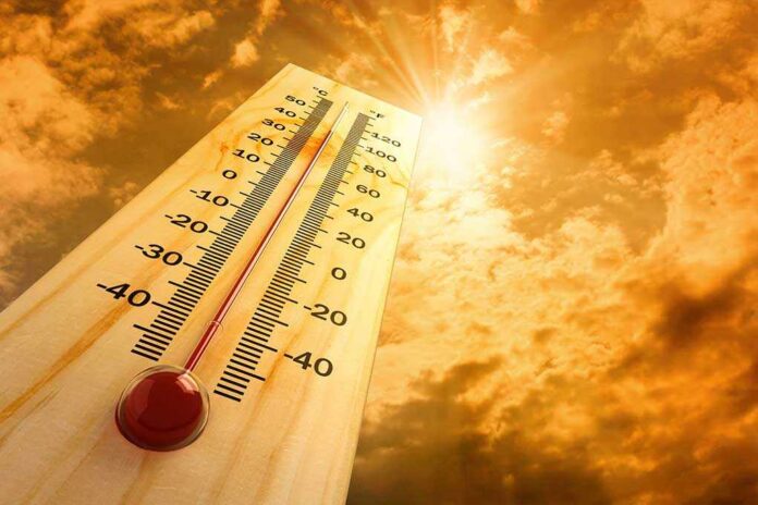 shutterstock_80404600.jpg A thermometer displaying temperature against a sunset sky
