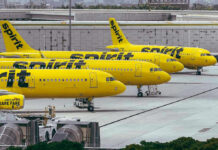 Yellow airplanes parked on the airport tarmac.