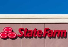 State Farm ABANDONS Fire Victims—Trump FURIOUS State Farm logo displayed on a building against a blue sky