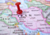 Trump’s IRAN Strike DELAYED – Gulf Royals ACT Red pushpin marking Iran on a map.