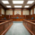 Pregnant Wife’s Murderer Caught in Italy Empty courthouse courtroom with wooden benches and chairs.