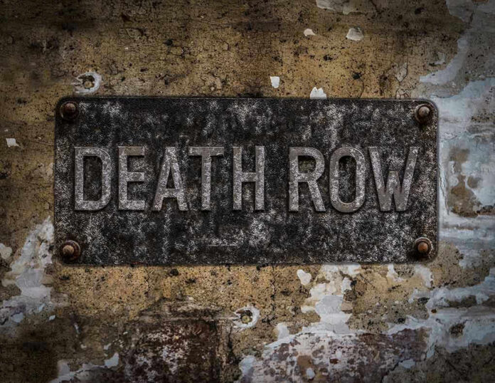 533872477 Weathered Death Row sign on aged concrete wall