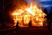 CA Wildfires SPARK CHAOS – Urgent Evacuations! House engulfed in flames with firefighters present.