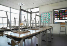 Teacher Beheaded on Video – Entire Nation STUNNED! Empty classroom with chairs on top of desks.