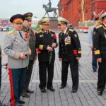 OLDEST Pearl Harbor Hero Reveals Real Victory Group of military officers in uniforms holding flowers in Red Square