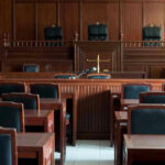 SCOTUS Denies Desperate Appeal From Death Row Inmate! Empty courtroom with wooden furnishings and judges bench.