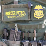 Pool Cam Captures ICE Heroics! Border Patrol vest with gear and communication equipment.
