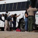 Trump Reaches NEW Milestone – Zero Releases Shocks Border! Border patrol officers investigating people near a bus.