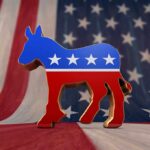 Dem Disarray As Prominent Senator Calls for New Leadership A donkey symbol representing the Democratic Party in front of an American flag background