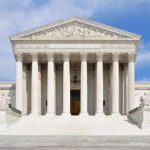 Dem Senator Issues Court-Packing Bombshell Plot! Front view of the Supreme Court building with large columns and steps under a blue sky