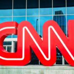 Dem Senator TORCHES Disgraced Colleague On CNN! Large red CNN logo in front of a glass building