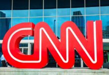 Dem Senator TORCHES Disgraced Colleague On CNN! Large red CNN logo in front of a glass building