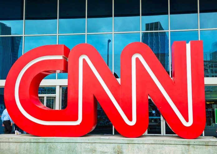 Atlanta,-,May,04:,Cnn,Center,In,Atlanta,On,May Large red CNN logo in front of a glass building