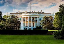 Mother’s Warning THWARTS White House Terror Attack! The White House surrounded by greenery and a fountain in the foreground