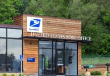 USPS Insiders Exposed In $63M Mail-Theft Heist! Exterior view of a modern United States Post Office building surrounded by greenery
