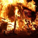 Historic Catholic Churches ABLAZE As France Burns! A large fire engulfing debris at night