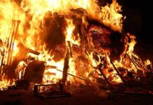 Historic Catholic Churches ABLAZE As France Burns! A large fire engulfing debris at night