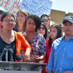 Hollywood Blast Ignites Tlaib Firestorm Group of people at an outdoor press event.