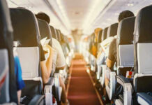 Midair Window Scare – Passenger Nearly Sucked Out! Passengers seated inside an airplane cabin.