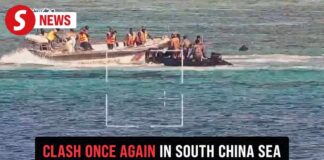Chinese vessel spraying water cannon at Philippine ship at Scarborough Shoal