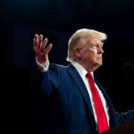 Federal Court Defies SCOTUS, Firings HALTED A man in a suit gesturing during a speech