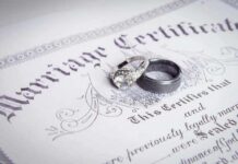 Shock Vote: Marriage Officially Defined as THIS Two wedding rings resting on a marriage certificate
