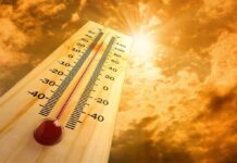 Hundreds Hospitalized in Disaster Heatwave A thermometer displaying temperature against a sunset sky