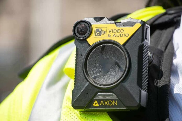 shutterstock_1438248011 Body-worn camera attached to a high-visibility vest