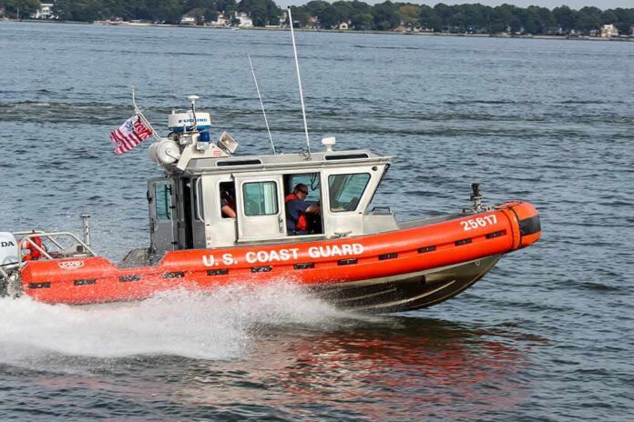 shutterstock_1750211480 Coast Guard patrol boat speeding across a bay