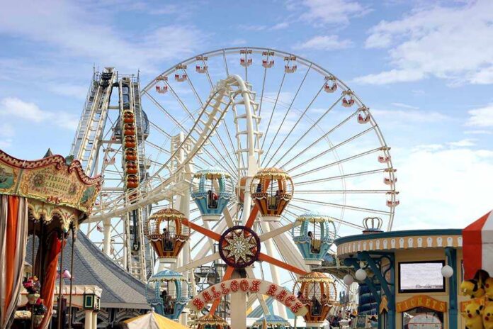 Amusement,Park,Rides Colorful amusement park scene featuring a ferris wheel and carousel