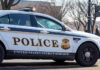 U.S Cop Turned Russian Spy HOODWINKED Secret Service United States Secret Service police car on roadside.