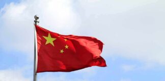 Chinese national flag waving on a flagpole