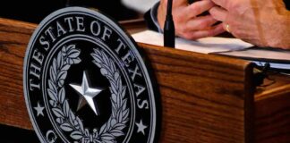 Texas governor seal on wooden podium