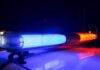 Barber ARRESTED In Sweeney Todd Style Attack Police car light bar flashing blue and red at night