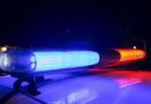 Flock Mayhem, Woman Wrongly ARRESTED! Police car light bar flashing blue and red at night