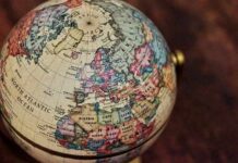 UN Map Revolt: America Stands Alone Vintage globe showing Europe, North Africa, and the North Atlantic