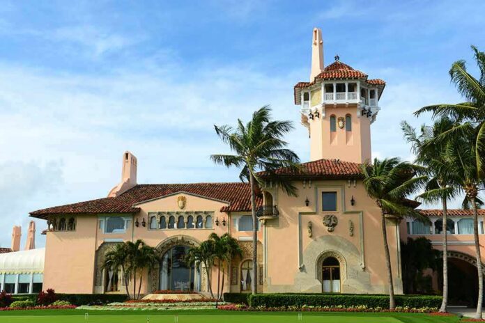 shutterstock_1344473333 Mediterranean Revival mansion with tower and palm trees