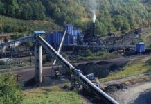 Coal processing plant with conveyor belts in a forested valley