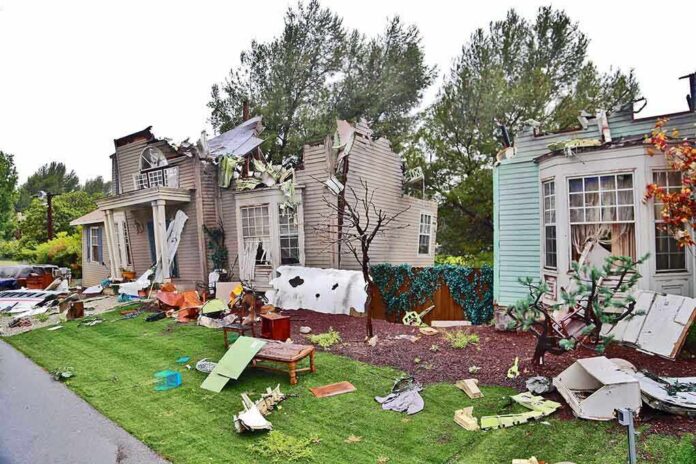 shutterstock_142581454 Houses with significant storm damage and debris scattered around the yard