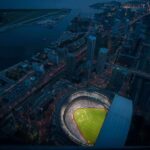Fuming MLB Manager Announces His Own Firing Baseball stadium illuminated at night in a coastal city